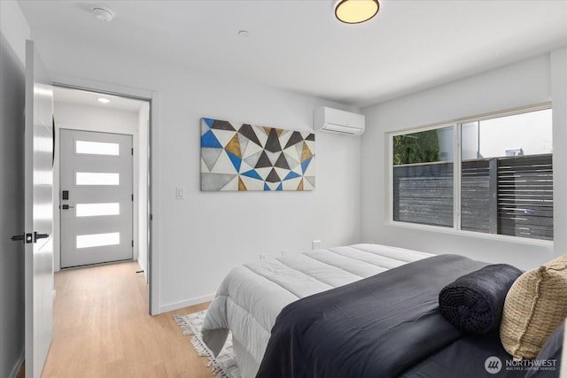 918 28th Ave S Unit B, Seattle, WA 98144 - bedroom featuring light wood finished floors and a wall mounted AC
