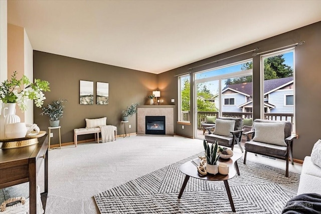 9411 18th Ave W Unit B, Everett, WA 98204 - carpeted living room featuring a fireplace and baseboards