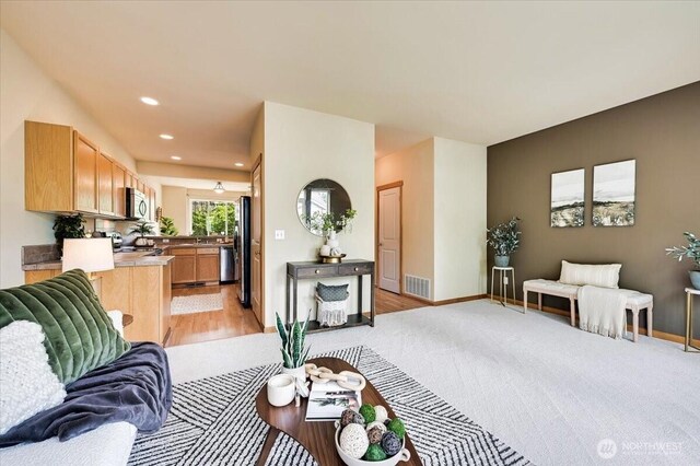 9411 18th Ave W Unit B, Everett, WA 98204 - living area with recessed lighting, light wood-type flooring, and light colored carpet
