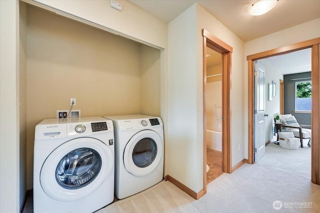 9411 18th Ave W Unit B, Everett, WA 98204 - washroom featuring washing machine and dryer and light carpet