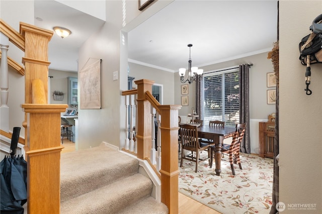2060 Hammond Ave, Dupont, WA 98327 - stairway with a chandelier, wood finished floors, and ornamental molding