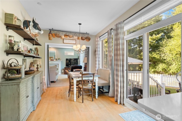 2060 Hammond Ave, Dupont, WA 98327 - dining room featuring light wood-style flooring and a chandelier