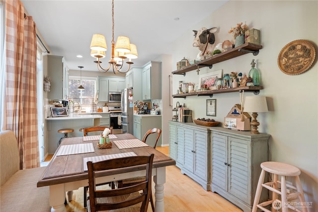 2060 Hammond Ave, Dupont, WA 98327 - dining area with a chandelier and light wood-style flooring
