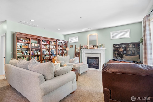 2060 Hammond Ave, Dupont, WA 98327 - living room with light carpet, a tile fireplace, and recessed lighting