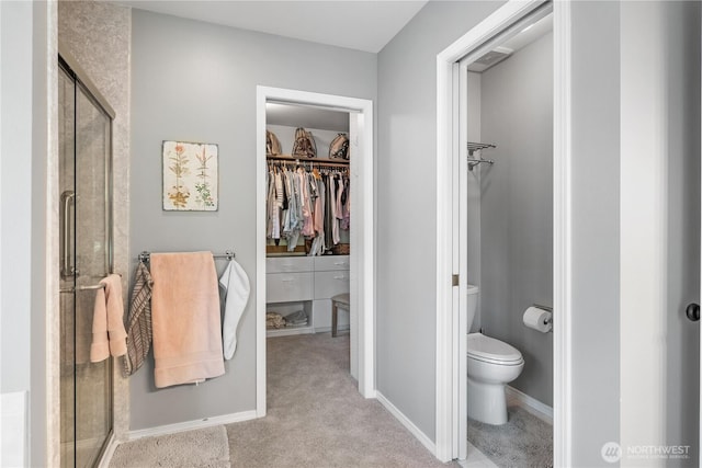2060 Hammond Ave, Dupont, WA 98327 - full bathroom featuring a walk in closet and a stall shower