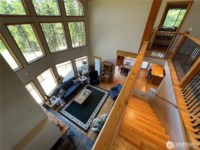 4 Ruger Rd, Oroville, WA 98844 - living area featuring a towering ceiling, wood finished floors, and stairway