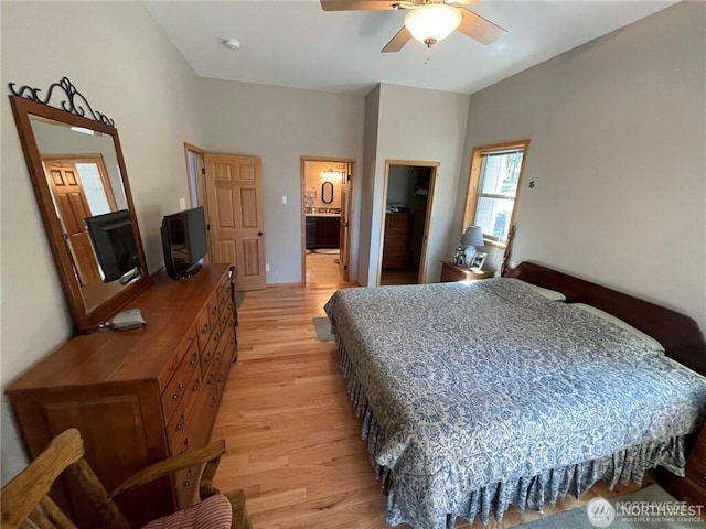4 Ruger Rd, Oroville, WA 98844 - bedroom with light wood finished floors, lofted ceiling, ensuite bathroom, and a ceiling fan