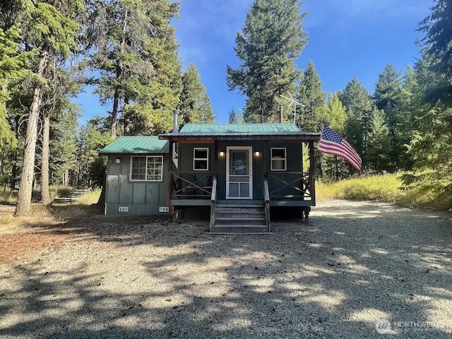 4 Ruger Rd, Oroville, WA 98844 - view of front of property featuring a metal roof, crawl space, and covered porch