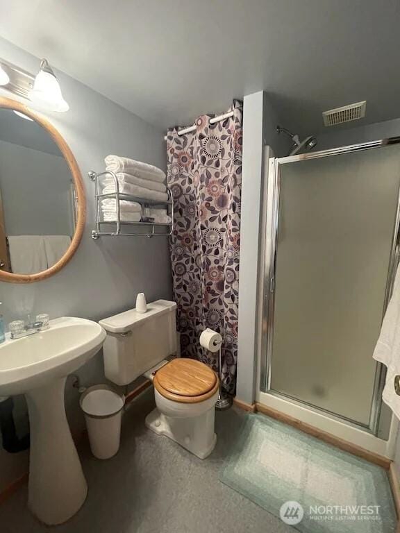 4 Ruger Rd, Oroville, WA 98844 - bathroom with a stall shower and toilet