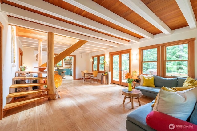 1692 Galbraith Ln, Bellingham, WA 98229 - living area with beam ceiling, french doors, light wood-style flooring, and plenty of natural light