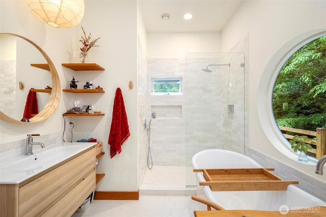 1692 Galbraith Ln, Bellingham, WA 98229 - bathroom with vanity, a freestanding bath, a tile shower, tile patterned floors, and recessed lighting