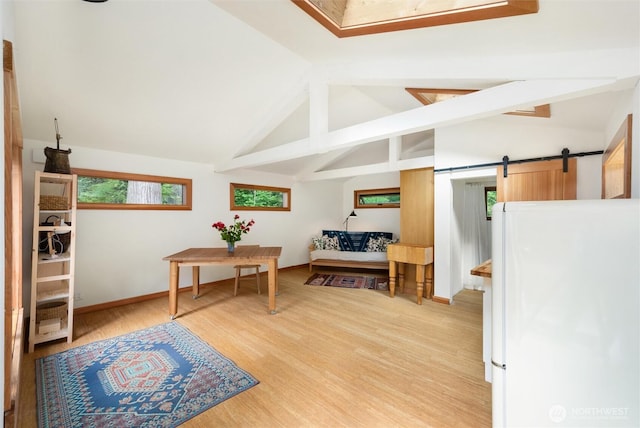 1692 Galbraith Ln, Bellingham, WA 98229 - office area featuring a barn door, light wood-type flooring, beam ceiling, and high vaulted ceiling