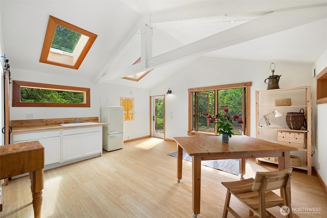 1692 Galbraith Ln, Bellingham, WA 98229 - dining room with a skylight and light wood-style floors