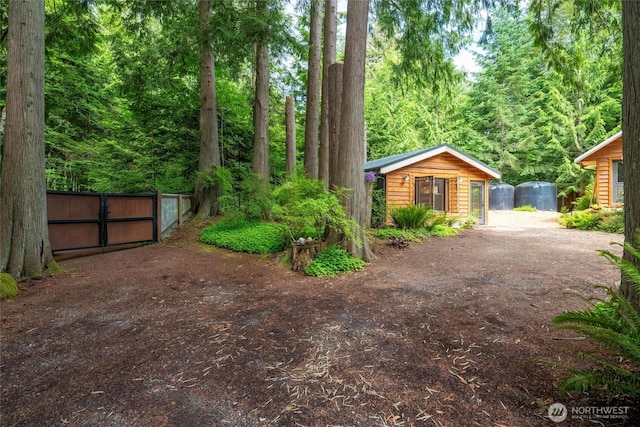 1692 Galbraith Ln, Bellingham, WA 98229 - view of yard featuring an outbuilding and a wooded view