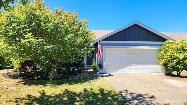230 Goldmyer Dr, Chehalis, WA 98532 - view of front facade featuring driveway, a garage, board and batten siding, and a front yard