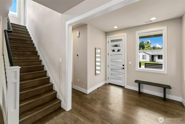 10702 39th Ave NE, Seattle, WA 98125 - foyer entrance featuring dark wood finished floors, stairway, and recessed lighting