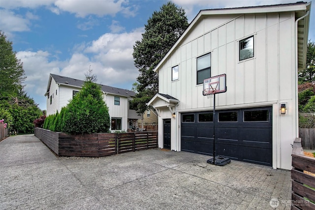 10702 39th Ave NE, Seattle, WA 98125 - modern inspired farmhouse with board and batten siding, driveway, and a garage