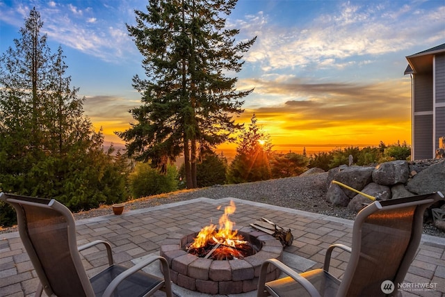 52 Carriage Dr, Sequim, WA 98382 - patio terrace at dusk with an outdoor fire pit and a patio area