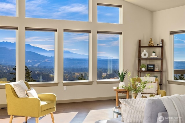 52 Carriage Dr, Sequim, WA 98382 - living room with wood finished floors, a mountain view, and healthy amount of natural light