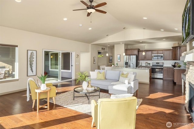 52 Carriage Dr, Sequim, WA 98382 - living area with lofted ceiling, ceiling fan, dark wood-style floors, a fireplace, and recessed lighting