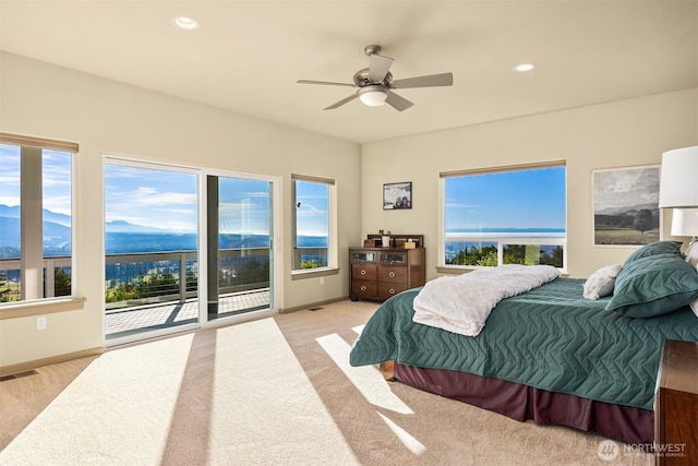 52 Carriage Dr, Sequim, WA 98382 - bedroom featuring light colored carpet, access to exterior, multiple windows, and recessed lighting