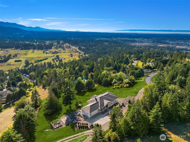 52 Carriage Dr, Sequim, WA 98382 - aerial view of property and surrounding area featuring a heavily wooded area