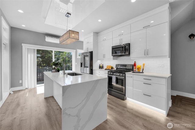 1315 Astor St, Bellingham, WA 98225 - kitchen with modern cabinets, appliances with stainless steel finishes, backsplash, white cabinets, and recessed lighting