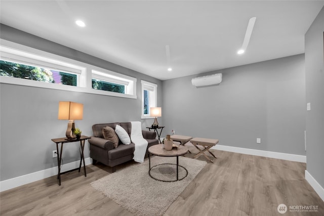 1315 Astor St, Bellingham, WA 98225 - living room featuring wood finished floors, recessed lighting, and a wall unit AC