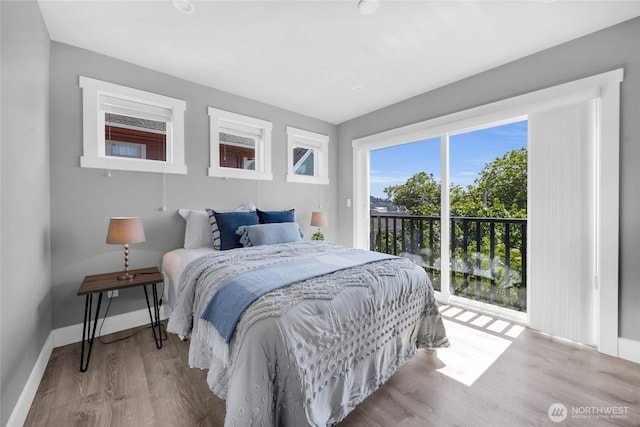 1315 Astor St, Bellingham, WA 98225 - bedroom featuring access to exterior and wood finished floors