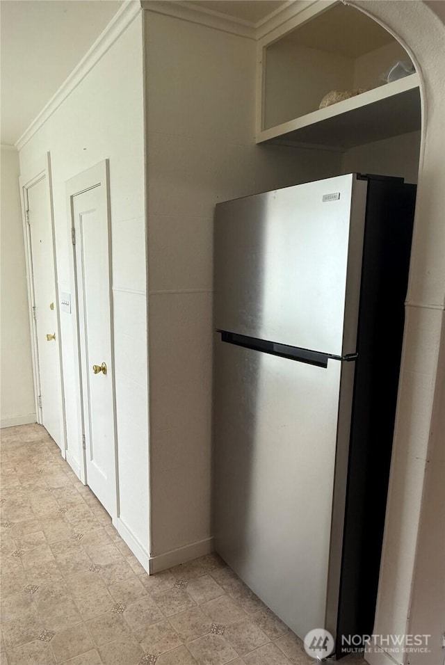 1019 Duryea St, Raymond, WA 98577 - kitchen featuring freestanding refrigerator and ornamental molding