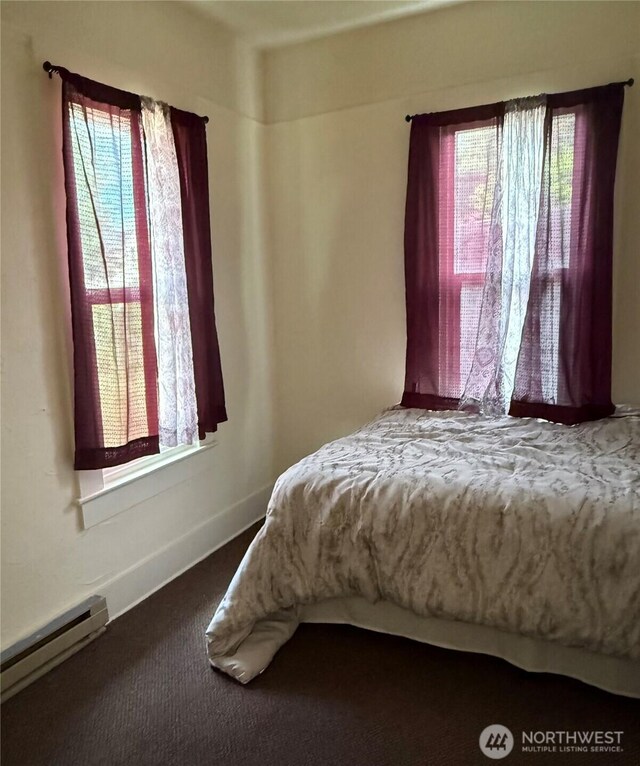 1019 Duryea St, Raymond, WA 98577 - bedroom featuring a baseboard radiator and carpet flooring