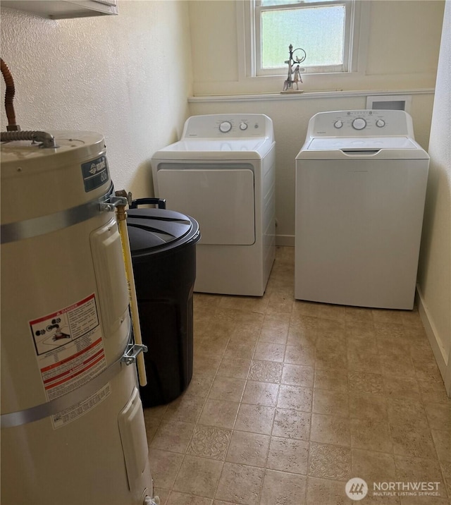 1019 Duryea St, Raymond, WA 98577 - laundry area with strapped water heater, independent washer and dryer, and light stone finish flooring