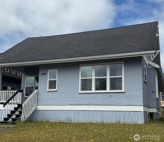 1019 Duryea St, Raymond, WA 98577 - view of side of home featuring a shingled roof
