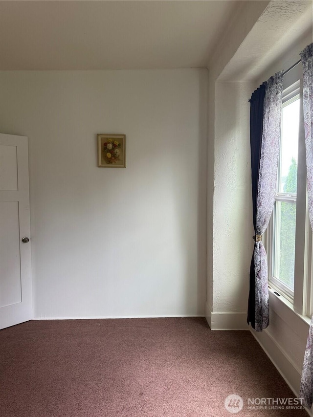 1019 Duryea St, Raymond, WA 98577 - empty room with plenty of natural light and carpet flooring