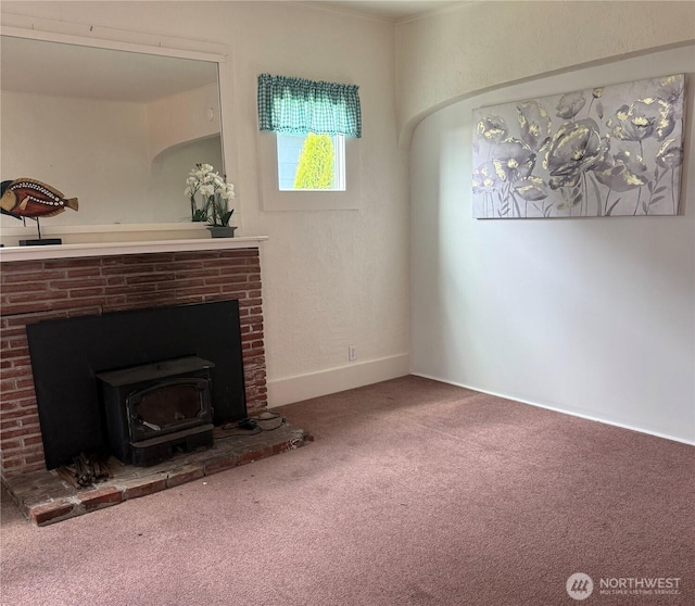1019 Duryea St, Raymond, WA 98577 - unfurnished living room with carpet flooring and a wood stove
