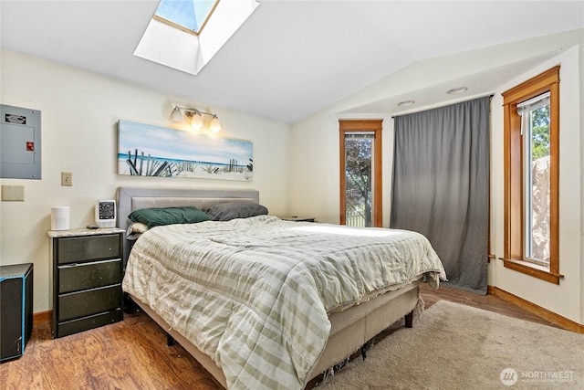 2639 Yew St, Bellingham, WA 98226 - bedroom featuring wood finished floors, vaulted ceiling, electric panel, and a skylight