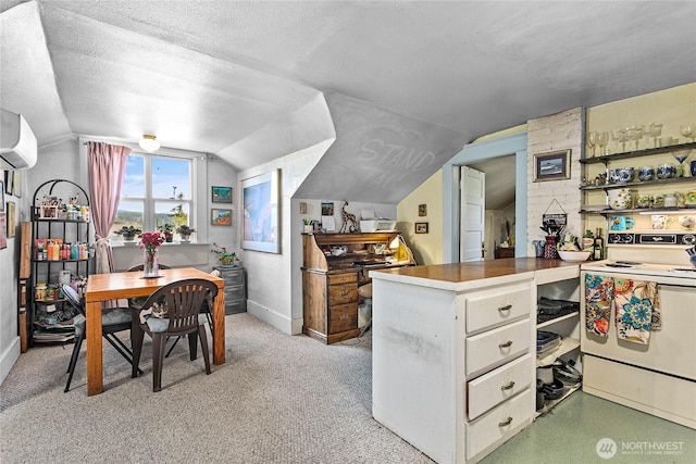 2639 Yew St, Bellingham, WA 98226 - kitchen featuring electric range, vaulted ceiling, a wall unit AC, and open shelves