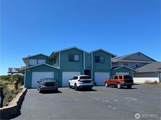 1051 Ocean Shores Blvd SW Unit 1B, Ocean Shores, WA 98569 - traditional home featuring an attached garage