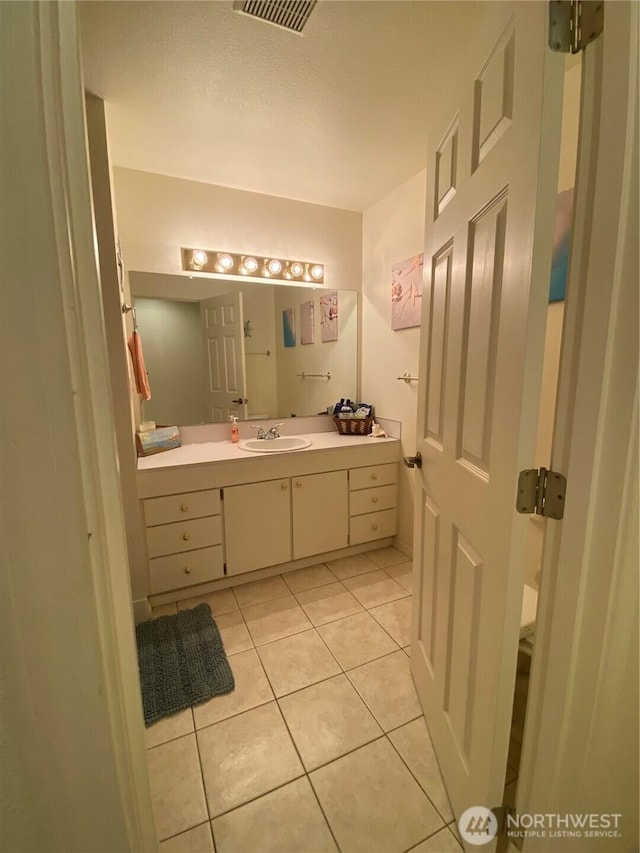 1051 Ocean Shores Blvd SW Unit 1B, Ocean Shores, WA 98569 - bathroom featuring tile patterned flooring and vanity