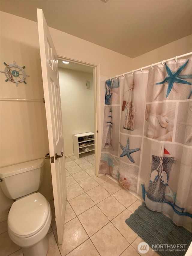 1051 Ocean Shores Blvd SW Unit 1B, Ocean Shores, WA 98569 - bathroom featuring tile patterned floors and a shower with curtain
