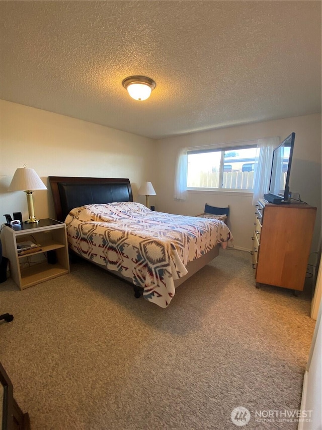1051 Ocean Shores Blvd SW Unit 1B, Ocean Shores, WA 98569 - carpeted bedroom featuring a textured ceiling