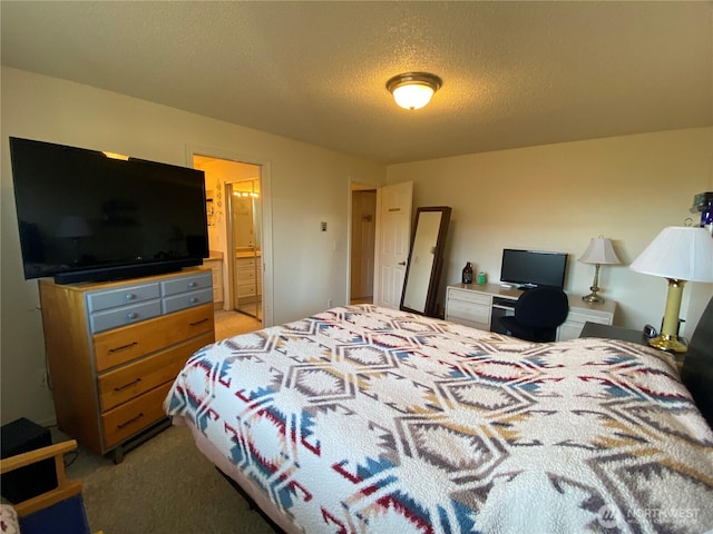 1051 Ocean Shores Blvd SW Unit 1B, Ocean Shores, WA 98569 - bedroom featuring light carpet, a textured ceiling, and ensuite bath
