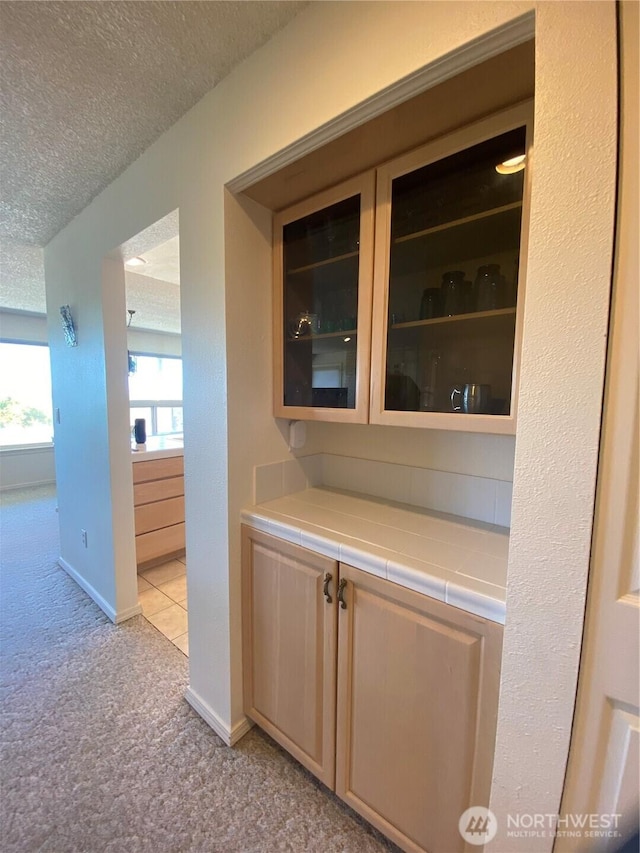 1051 Ocean Shores Blvd SW Unit 1B, Ocean Shores, WA 98569 - bar area with light colored carpet and a textured ceiling