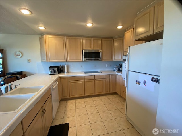 1051 Ocean Shores Blvd SW Unit 1B, Ocean Shores, WA 98569 - kitchen featuring freestanding refrigerator, light brown cabinetry, tile countertops, stainless steel microwave, and light tile patterned floors