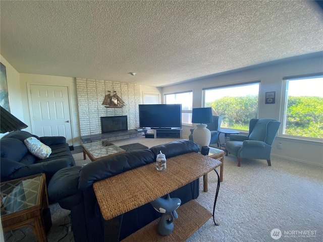 1051 Ocean Shores Blvd SW Unit 1B, Ocean Shores, WA 98569 - carpeted living room featuring a textured ceiling and a brick fireplace