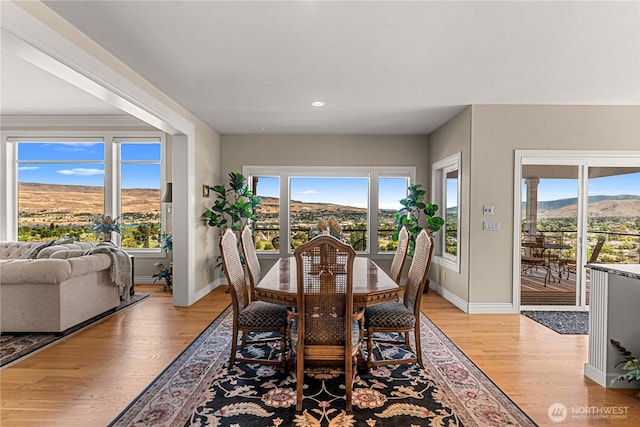 1776 Broadway Pl, Wenatchee, WA 98801 - dining space with light wood-style flooring, a mountain view, and recessed lighting