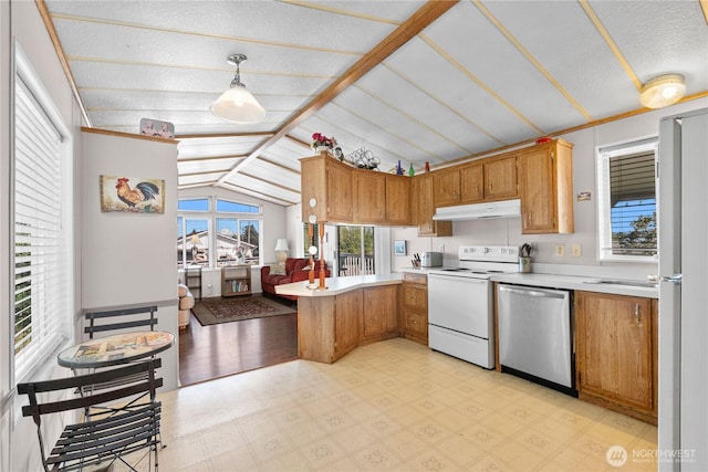 5594 Hillvue Rd, Blaine, WA 98230 - kitchen with a peninsula, white appliances, light countertops, light flooring, and pendant lighting