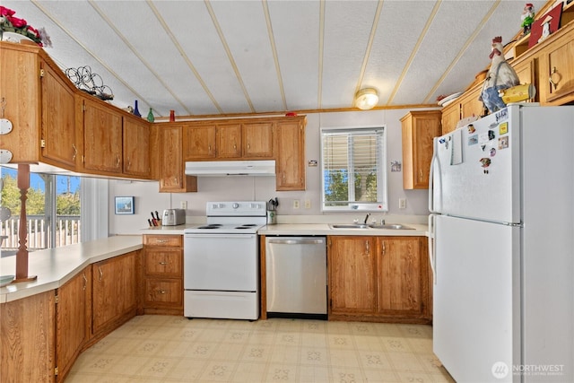 5594 Hillvue Rd, Blaine, WA 98230 - kitchen with white appliances, light countertops, light floors, and brown cabinets