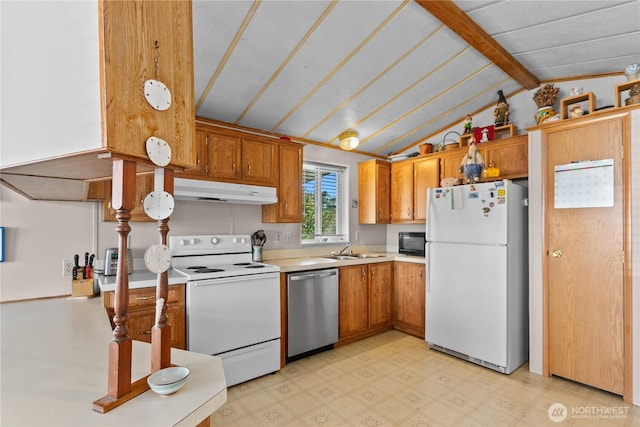 5594 Hillvue Rd, Blaine, WA 98230 - kitchen featuring white appliances, light countertops, brown cabinetry, and under cabinet range hood
