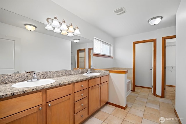 6214 Malloy Ave, Ferndale, WA 98248 - full bathroom with double vanity, a bath, tile patterned floors, and a spacious closet